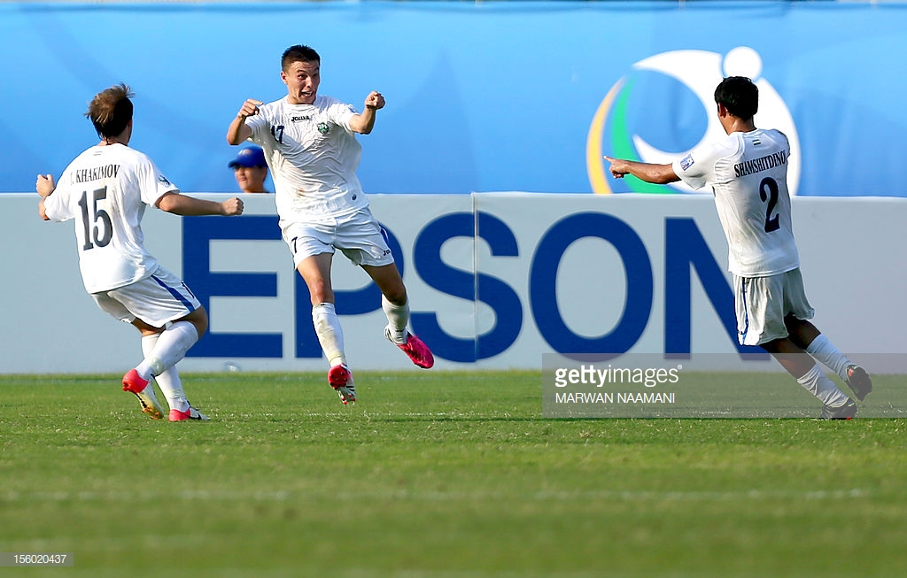 uzbekistans-igor-sergeev-celebrates-after-scoring-a-goal-during-their-picture-id156020437