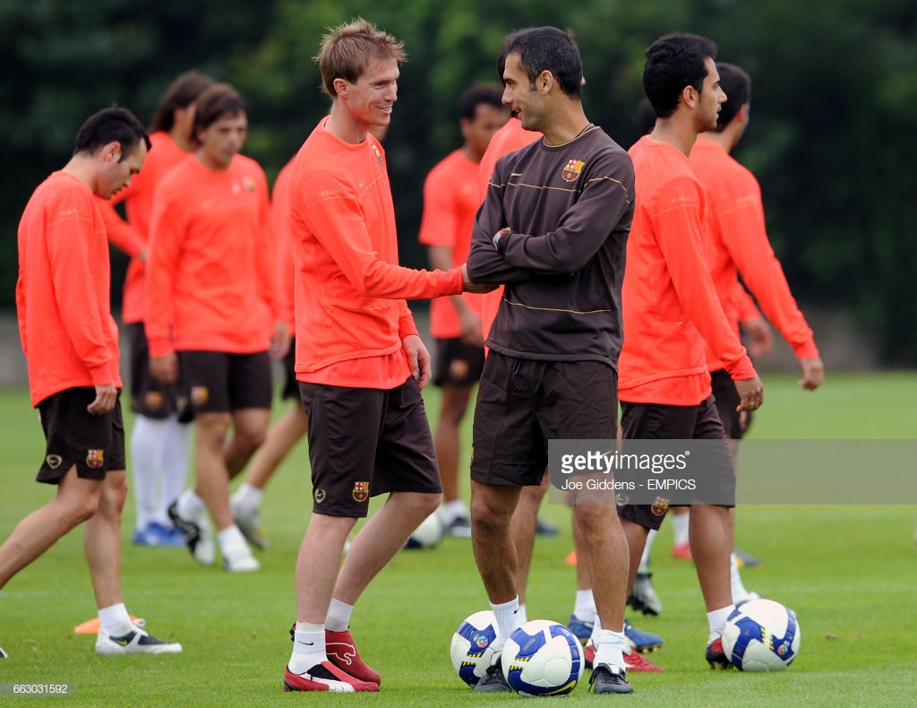 barcelonas-aleksandr-hleb-and-manager-josep-pep-guardiola-picture-id663031592